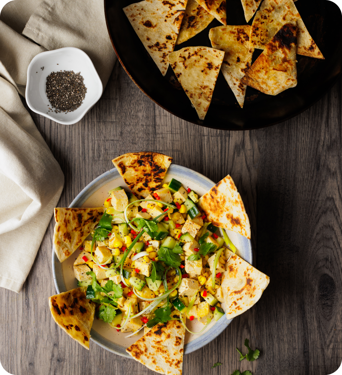 Fresh salad with tortilla triangles.