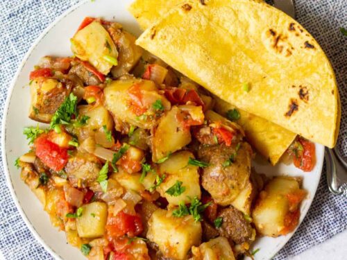 Hearty vegetable and meat stew served with toasted bread.