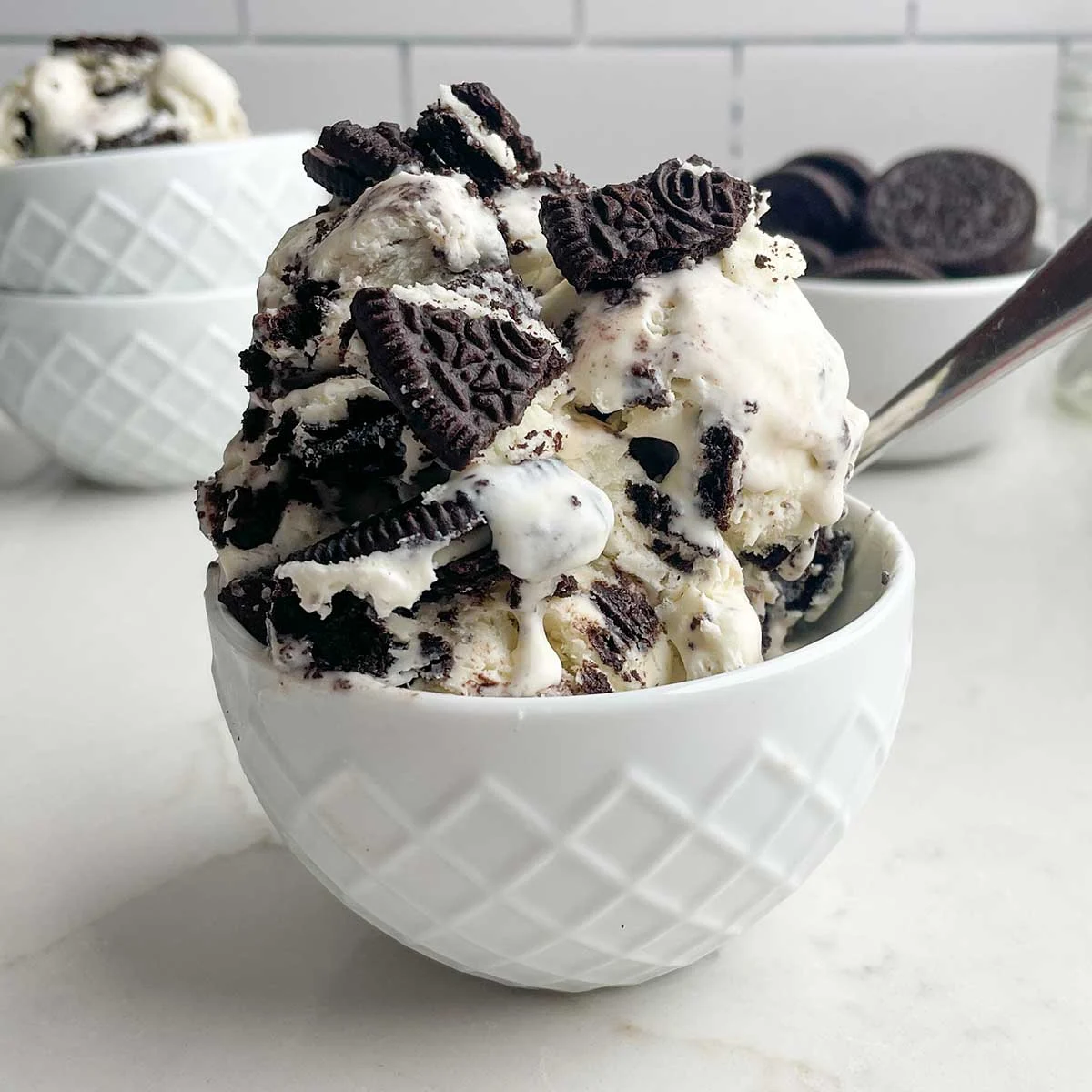 A bowl filled with cookies and cream ice cream.